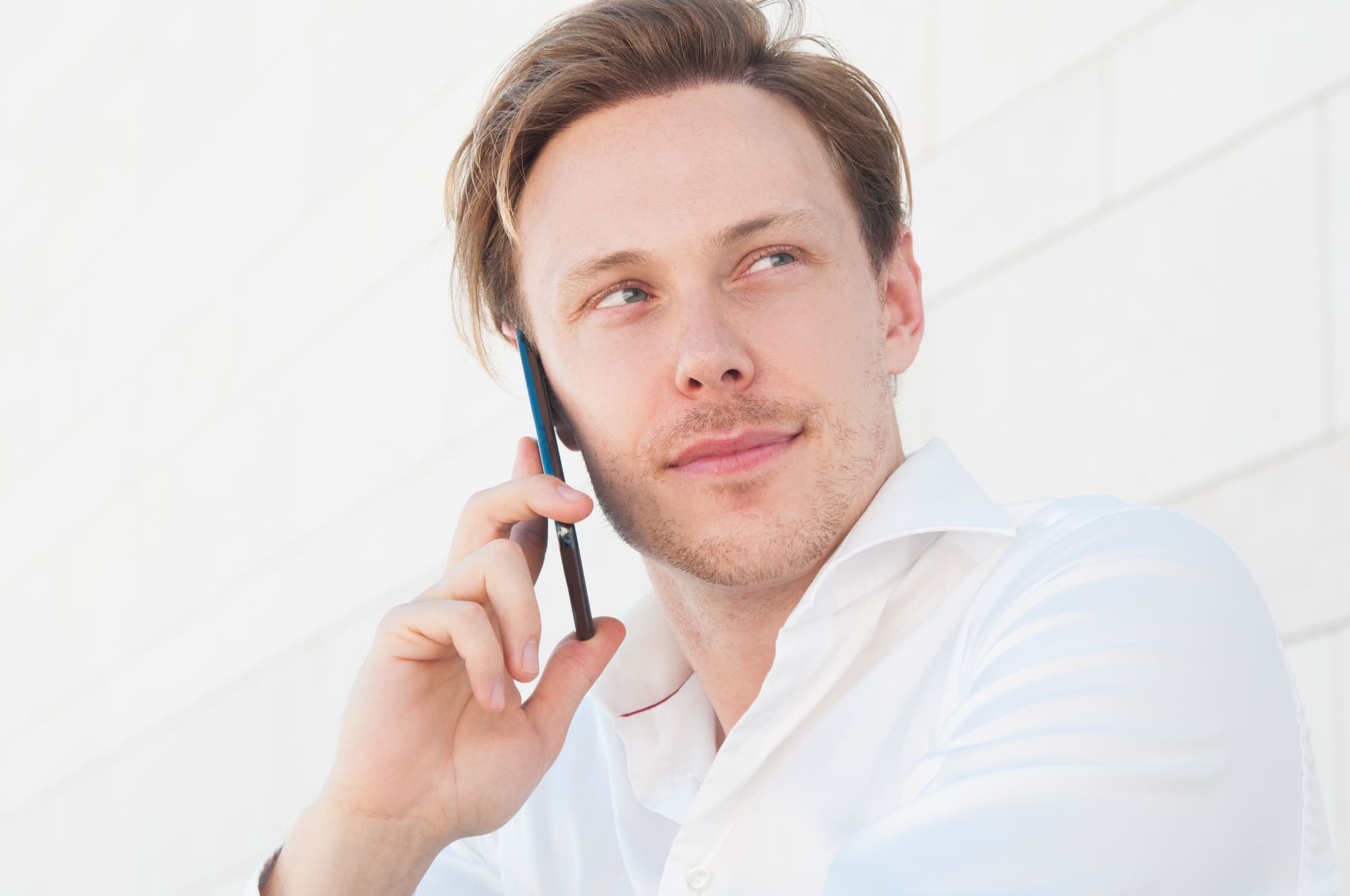 Pensive Business Man Calling Smartphone Outdoors